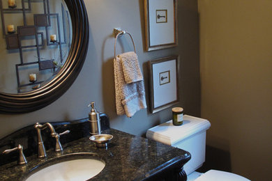 Example of a transitional powder room design in Detroit