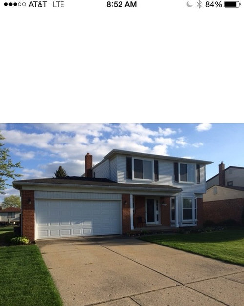 What color siding with orange brick?