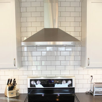 Geneseo, IL- White Painted Kitchen with Matte Black Granite and Subway Tile