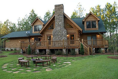 This is an example of a mid-sized arts and crafts two-storey brown house exterior in Atlanta with wood siding, a gable roof and a shingle roof.