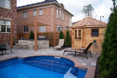 Large elegant backyard natural pool photo in Toronto