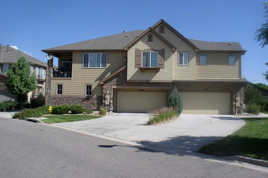 Mid-sized arts and crafts beige two-story mixed siding exterior home photo in Denver