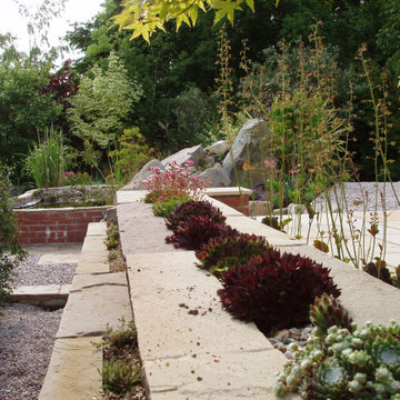 Raised Pond And Patio Design