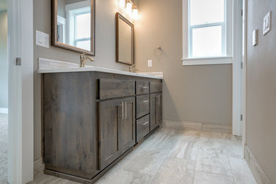 Inspiration for a mid-sized transitional master bathroom in Portland with shaker cabinets, dark wood cabinets, beige walls, ceramic floors, an undermount sink, quartzite benchtops, beige floor and white benchtops.