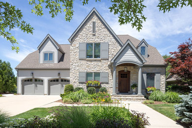Inspiration for a transitional gray two-story concrete fiberboard house exterior remodel in Grand Rapids