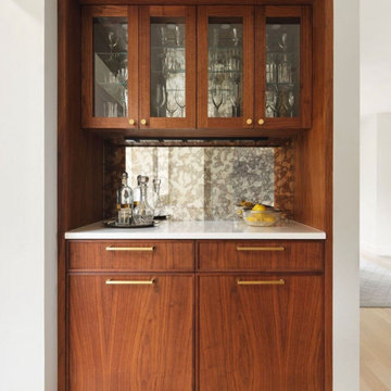 Custom Antique Mirrored Backsplash and Glass Cabinet Inserts for a Wet Bar