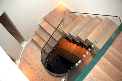 Curved Glass and Timber Stairs by Camel Gr