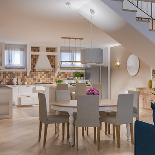 Inspiration for a large mediterranean walk-out basement in Milan with multi-coloured walls, terracotta flooring and pink floors.