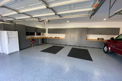 Garage workshop - huge contemporary detached three-car garage workshop idea in Atlanta