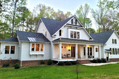 Example of a mid-sized country home design design