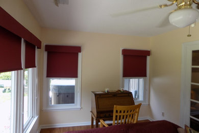 Study room - mid-sized traditional freestanding desk medium tone wood floor and brown floor study room idea in Other with yellow walls