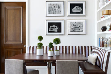 Example of a transitional dark wood floor dining room design in New York with white walls and no fireplace