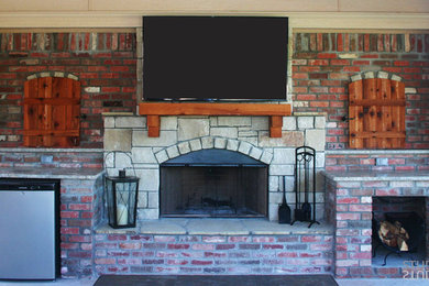 Example of a mid-sized classic backyard patio design in Oklahoma City with a fire pit