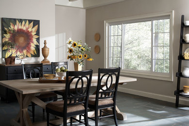 Mid-sized elegant slate floor and gray floor kitchen/dining room combo photo in Philadelphia with gray walls and no fireplace
