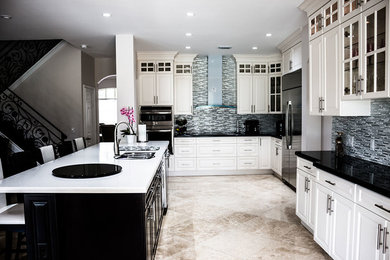 Large trendy u-shaped marble floor kitchen photo in Miami with a double-bowl sink, shaker cabinets, white cabinets, solid surface countertops, multicolored backsplash, metal backsplash, stainless steel appliances and an island