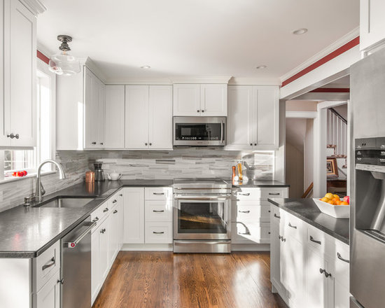 Transitional enclosed kitchen designs - Enclosed kitchen - transitional u-shaped medium tone wood floor and brown floor enclosed kitchen idea in Boston with a single-bowl sink, shaker cabinets, white cabinets, gray backsplash, subway tile backsplash and stainless steel appliances