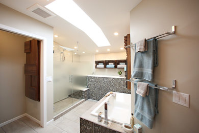 Large minimalist master multicolored tile beige floor bathroom photo in Minneapolis with flat-panel cabinets, medium tone wood cabinets, a hinged shower door, beige walls and an undermount sink
