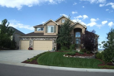 Mid-sized traditional beige two-story mixed siding gable roof idea in Denver