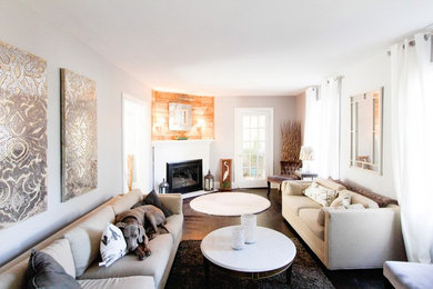 Example of a small trendy dark wood floor living room design in Baltimore with gray walls, a corner fireplace and a brick fireplace