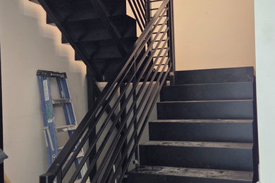 Staircase - large modern metal u-shaped metal railing staircase idea in Salt Lake City with metal risers
