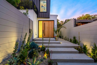 Inspiration for a contemporary two-story exterior home remodel in Los Angeles