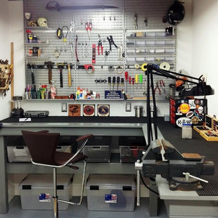 Small contemporary walk-out basement in Philadelphia with white walls, concrete flooring and no fireplace.