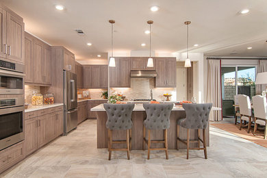Design ideas for a large contemporary l-shaped eat-in kitchen in San Diego with an undermount sink, shaker cabinets, light wood cabinets, quartz benchtops, beige splashback, matchstick tile splashback, stainless steel appliances, travertine floors, with island and beige floor.