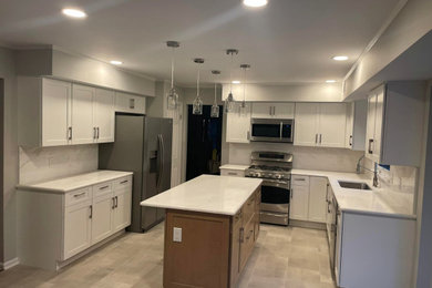 Mid-sized 1950s kitchen photo in New York with an island