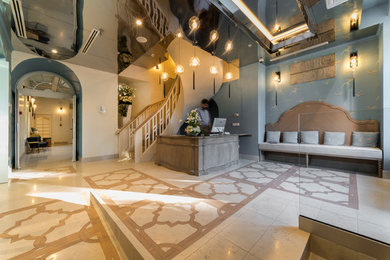 Design ideas for an expansive modern foyer in Venice with multi-coloured walls, marble floors and multi-coloured floor.