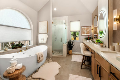 Mid-sized transitional master beige tile and porcelain tile porcelain tile, beige floor, double-sink and vaulted ceiling bathroom photo in Austin with shaker cabinets, medium tone wood cabinets, a two-piece toilet, beige walls, an undermount sink, quartz countertops, a hinged shower door and a built-in vanity