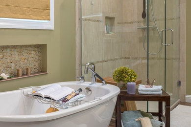 Freestanding bathtub - large modern master brown tile and porcelain tile porcelain tile freestanding bathtub idea in St Louis with a vessel sink, shaker cabinets, brown cabinets, onyx countertops, a one-piece toilet and green walls