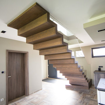 Zig zag staircase in wood with glass balustrade