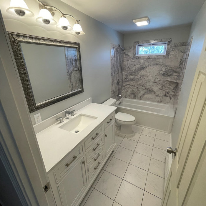 A bathroom with a bathtub and a sink