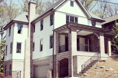 Photo of an arts and crafts three-storey beige exterior in Atlanta.