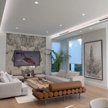 Cove Lighting, Downlights, and Frame TV on Stone - Pre-Wired Miami Living Room