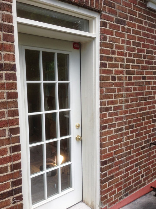 Cutting plastic grid off of balcony door. (Door Lite Insert)