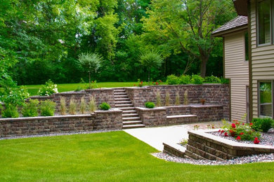Design ideas for a large partial sun side yard concrete paver landscaping in Minneapolis.