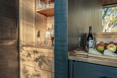 Mountain style home bar photo in Other