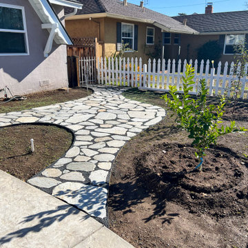 Front Yard Transformation (Cobblestone Fence, Grass, Idaho Quartzite Slabs)