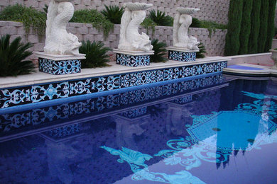 Large tuscan backyard stamped concrete and custom-shaped natural pool photo in Phoenix