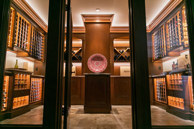 This is an example of a large traditional wine cellar in Chicago with diamond bins and brown floor.