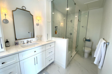 Corner shower - master white tile porcelain tile and white floor corner shower idea in Other