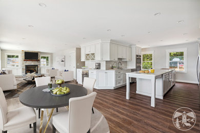Large elegant open concept vinyl floor and brown floor family room photo in Other with white walls, a standard fireplace, a stacked stone fireplace and a wall-mounted tv
