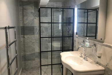 Design ideas for a medium sized modern grey and black shower room bathroom in London with a walk-in shower, a one-piece toilet, white walls, mosaic tile flooring, white floors, an open shower, feature lighting and a single sink.