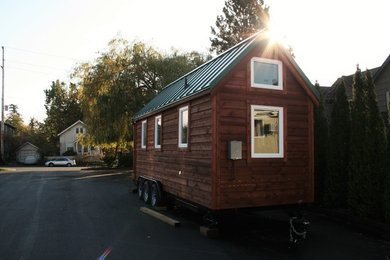 Inspiration for a small rustic brown one-story wood exterior home remodel in Seattle