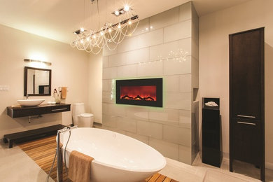 Inspiration for a large contemporary master gray tile and glass tile beige floor freestanding bathtub remodel in Vancouver with flat-panel cabinets, dark wood cabinets, beige walls and a vessel sink
