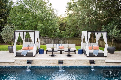 Large transitional backyard concrete paver pool fountain photo in Austin