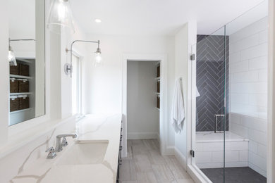 Example of a trendy master white tile and ceramic tile ceramic tile, gray floor and double-sink bathroom design in Cincinnati with recessed-panel cabinets, black cabinets, a two-piece toilet, white walls, an undermount sink, quartz countertops, a hinged shower door, white countertops and a freestanding vanity