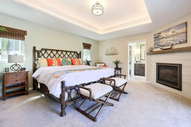 Mid-sized trendy master carpeted and coffered ceiling bedroom photo in San Francisco with a standard fireplace and a stone fireplace