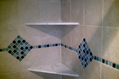 Ceramic tile alcove shower photo in Kansas City with beige walls